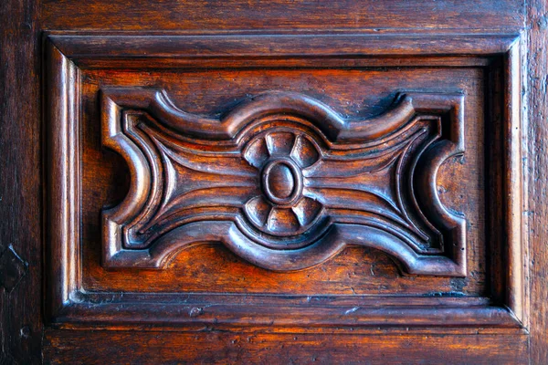 Inlay in wood . Wooden craft , ancient door ornate