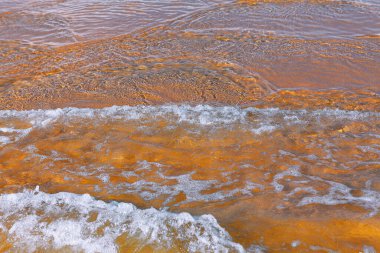 Ocean transparent water with foam . Shallow water waves