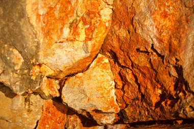 Natural clay rocks . Stone cliff background