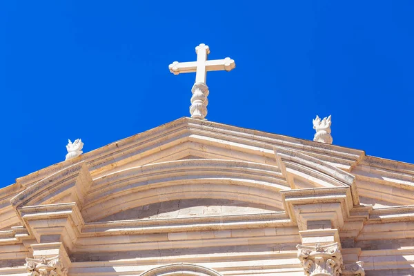Religious cross on the top of church . Christianity symbol white cross