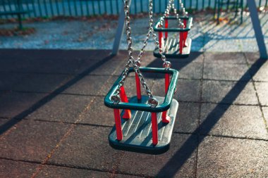 Swing in playground . Swing with silver chains