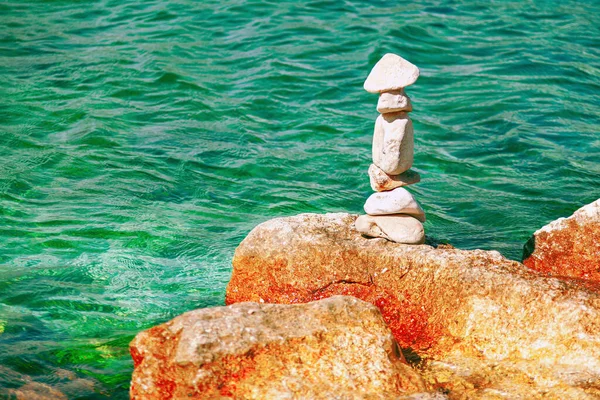 Balanced Rocks at Coast . Stone balancing at seaside