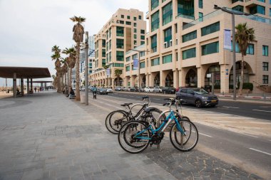 2.01.2023, Tel Aviv, Israel. Tel-Aviv city background. Street near the beach and Mediterranean Sea. Buildings, hotels, people and cars. City lifestyle. Israel Tourism.