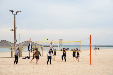 2.01.2023, Tel Aviv, Israel. Tel-Aviv city background. Street near the beach and Mediterranean Sea. Buildings, hotels, people and cars. City lifestyle. Israel Tourism.