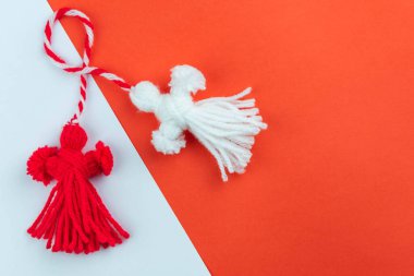 Traditional Martisor - symbol of holiday 1 March, Martenitsa, Baba Marta, beginning of spring and seasons changing in Romania, Bulgaria, Moldova. Greeting and post card for holidays.