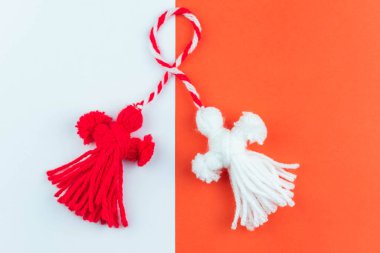 Traditional Martisor - symbol of holiday 1 March, Martenitsa, Baba Marta, beginning of spring and seasons changing in Romania, Bulgaria, Moldova. Greeting and post card for holidays.