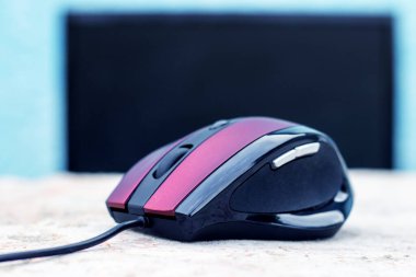 Computer mouse in the office near the computer