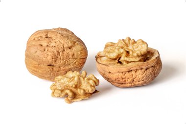 Walnuts peeled and unpeeled in the shell on white isolated background with shadow. Full depth of field