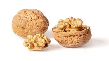 Walnuts peeled and unpeeled in the shell on white isolated background with shadow. Full depth of field