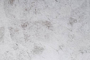 Gri bir beton duvarın yüzeyinden soyut bir arkaplan