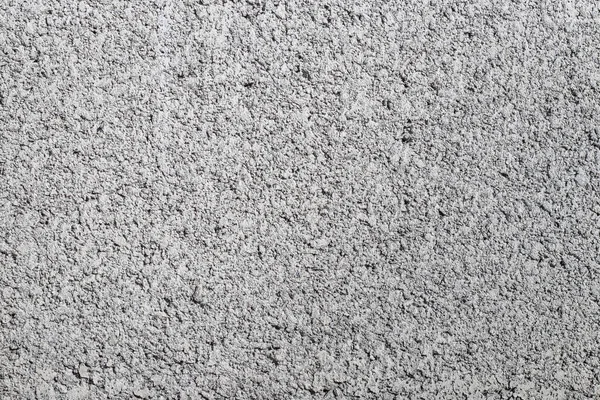 灰色の荒いコンクリートの壁の表面からの抽象的な背景 — ストック写真