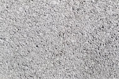 Gri bir beton duvarın yüzeyinden soyut bir arkaplan