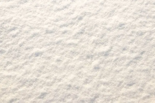Background with snow texture, snow surface on a sunny day