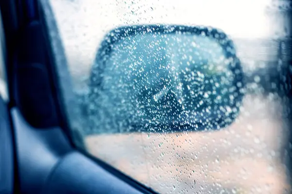 Raindrops on the car window, rainy weather