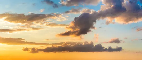 stock image Picturesque evening sky with whimsical clouds