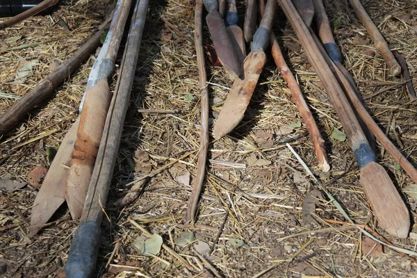Aboriginal Australians weapons on the ground.Spears used for hunting, fishing, fighting, retribution, ceremony, as commodities for trade and as symbolic markers of masculinity