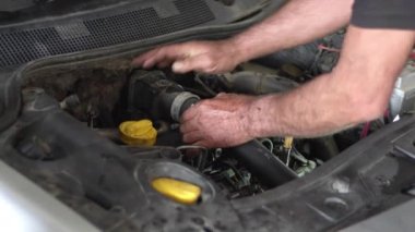 Changing the Car Air Filter Hose in the Repair Shop Footage.