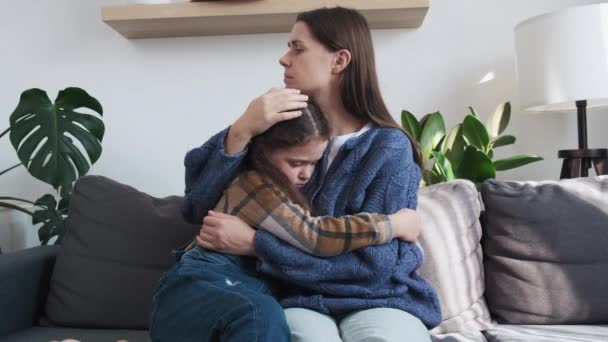 Caring Young Mother Embrace Little Frustrated Kid Sitting Couch Together — Stock Video