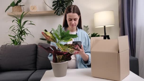Happy Young Woman Unbox Open Box New Green Plant Buy — Wideo stockowe