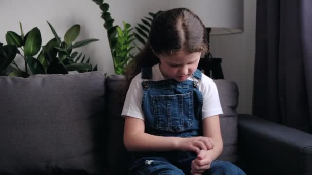 Close Unhealthy Sad Little Girl Child Sitting Alone Sofa Home — Stok video