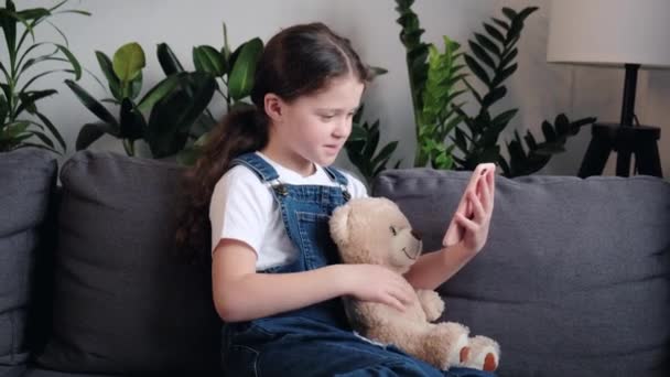 Cute Little Girl Child Holding Toy Bear Talking Followers Live — Stock videók
