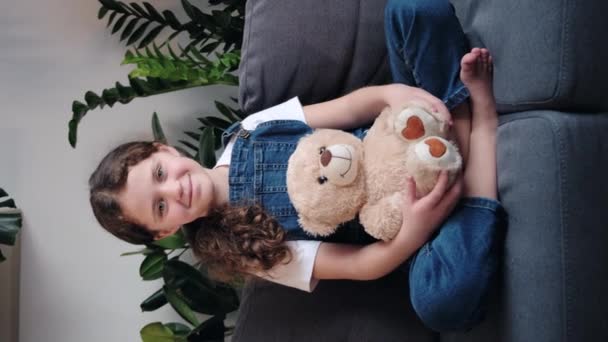 Vertical Video Portrait Smiling Adorable Little Girl Child Holding Fluffy — Stockvideo