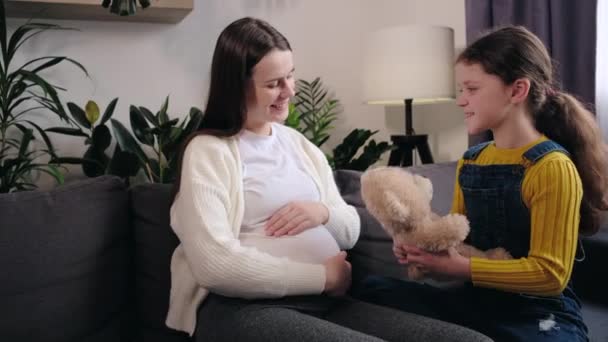 Happy Young Pregnant Mom Adorable Little Daughter Playing Teddy Bear — Stockvideo