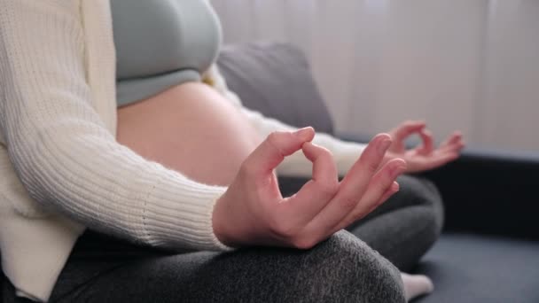 Selective Focus Young Pregnant Lady Large Bare Tummy Meditates Sitting — Stockvideo