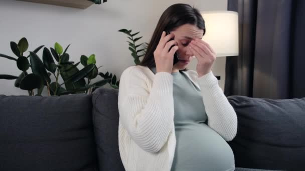 Stressed Young Caucasian Pregnant Woman Expectancy Sitting Alone Sofa Home — Wideo stockowe