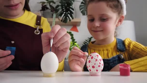 Close Young Mom Cute Little Kid Daughter Decorate Eggs Paints — Stock Video