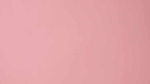 Vertical Shot Female Hand Holding Blue Ribbon Posing Pink Background — Stock Video