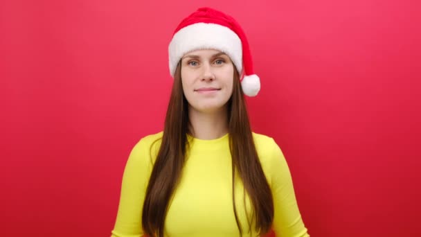 Merry Smiling Young Woman Wearing Yellow Sweater Santa Claus Hat — Stock Video