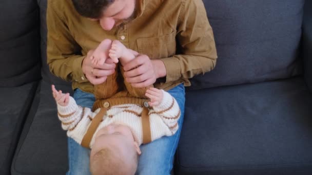 Pretty Little Baby Lying Daddy Laps Playing Couch Living Room — Stock Video