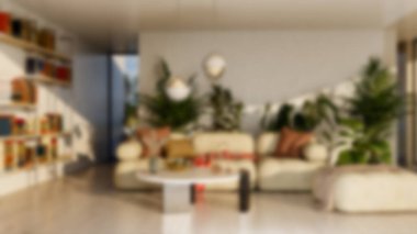 Modern bir oturma odasının bulanık arka planı, parlak ve solunabilir, doğal ışık, mobilyalar ve davetkar koltuk düzenlemeleri, sessiz ve stil bir atmosfer yaratıyor.