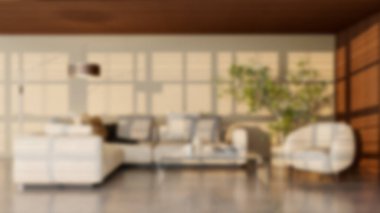 Modern bir oturma odasının bulanık arka planı, parlak ve solunabilir, doğal ışık, mobilyalar ve davetkar koltuk düzenlemeleri, sessiz ve stil bir atmosfer yaratıyor.