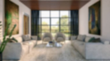 Modern bir oturma odasının bulanık arka planı, parlak ve solunabilir, doğal ışık, mobilyalar ve davetkar koltuk düzenlemeleri, sessiz ve stil bir atmosfer yaratıyor.