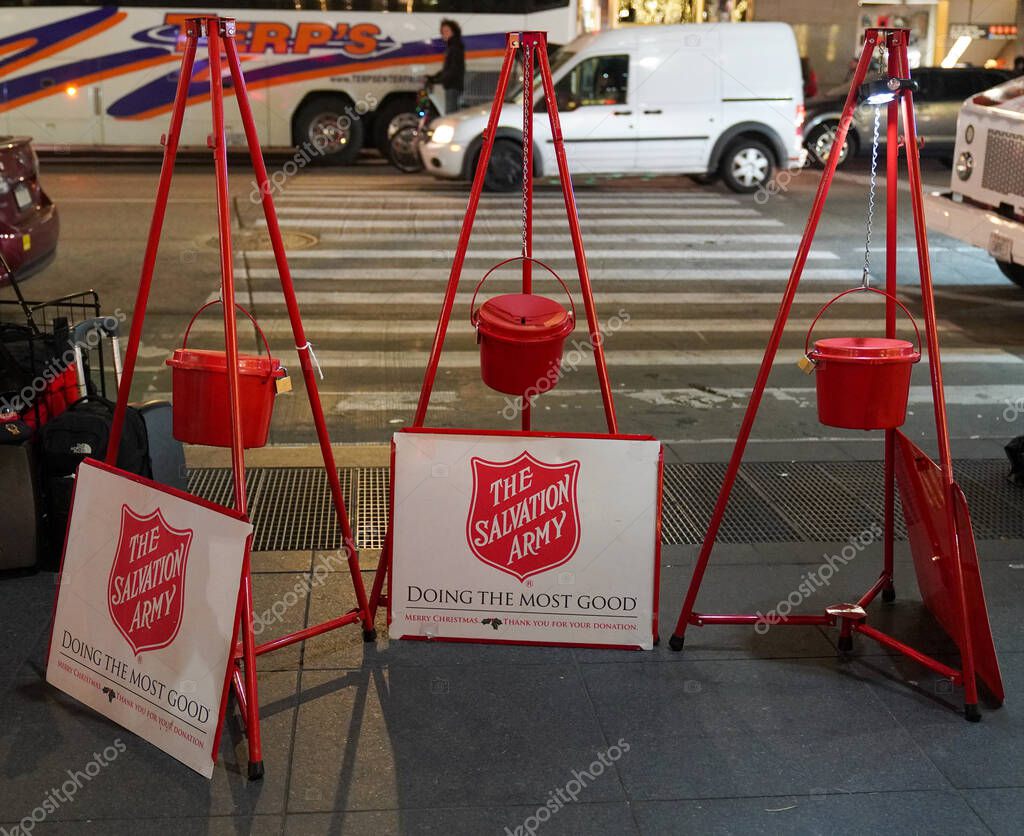 Salvation Army red kettles for collections in midtown Manhattan. This Christian organization is known for its charity work, operating in 126 countries