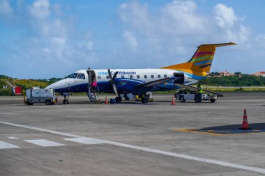 ST. GEORGE, GRENADA - JANUARY 3, 2023: An InterCaribbean Airways Embraer 120 plane on tarmac at Maurice Bishop International Airport in Grenada