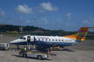 ST. GEORGE, GRENADA - JANUARY 3, 2023: An InterCaribbean Airways Embraer 120 plane on tarmac at Maurice Bishop International Airport in Grenada