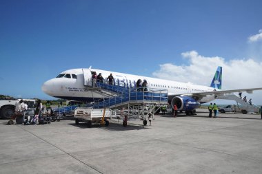 ST. GEORGE, GRENADA - DECEMBER 30, 2022: JetBlue plane on tarmac at Maurice Bishop International Airport in Grenada