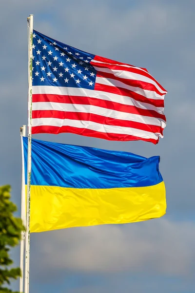 American and Ukrainian flags in the wind