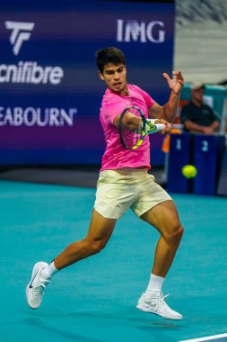 MIAMI GARDENS, FLORIDA - MARCH 29, 2023: Carlos Alcaraz of Spain in action during quarter-final match against Taylor Fritz of United States at 2023 Miami Open at the Hard Rock Stadium in Miami Gardens, Florida, USA clipart