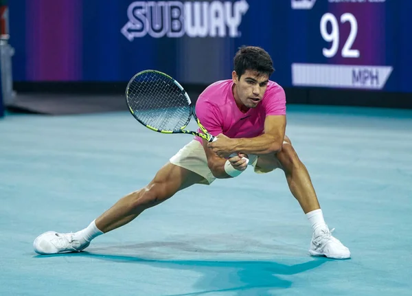 stock image MIAMI GARDENS, FLORIDA - MARCH 29, 2023: Carlos Alcaraz of Spain in action during quarter-final match against Taylor Fritz of United States at 2023 Miami Open at the Hard Rock Stadium in Miami Gardens, Florida, USA