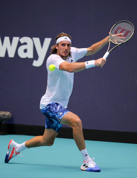 MIAMI GARDENS, FLORIDA - MARCH 27, 2023: Stefanos Tsitsipas of Greece in action during round 3 match against Cristian Garin of Chile at 2023 Miami Open at the Hard Rock Stadium in Miami Gardens, Florida, USA