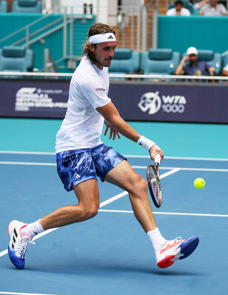 MIAMI GARDENS, FLORIDA - MARCH 27, 2023: Stefanos Tsitsipas of Greece in action during round 3 match against Cristian Garin of Chile at 2023 Miami Open at the Hard Rock Stadium in Miami Gardens, Florida, USA