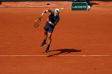 PARIS, FRANCE - MAY 30, 2022: Professional tennis player Holger Rune of Denmark in action during his round 4 match against Stefanos Tsitsipas of Greece at 2022 Roland Garros in Paris, France