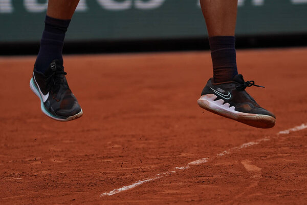 PARIS, FRANCE - MAY 30, 2022: Professional tennis player Holger Rune of Denmark wears Nike tennis shoes during his round 4 match against Stefanos Tsitsipas of Greece at 2022 Roland Garros in Paris, France