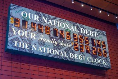 View of the National Debt Clock in Midtown Manhattan. The clock shows gross national debt and each family's share of that debt  clipart