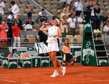 PARIS, FRANCE - JUNE 8, 2023: Professional tennis player Iga Swiatek of Poland celebrates victory after women singles semi-final match against Beatriz Haddad Maia of Brazil at 2023 Roland Garros in Paris, France clipart