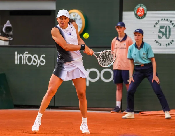 stock image PARIS, FRANCE - MAY 30, 2023: Professional tennis player Iga Swiatek of Poland in action during women singles first round match against Cristina Bucsa of Spain at 2023 Roland Garros in Paris, France